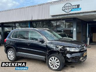 Vaurioauto  passenger cars Volkswagen Tiguan 1.4 TSI R-Line DSG Dynaudio Stoelverwarming Climate Cruise 2014/1