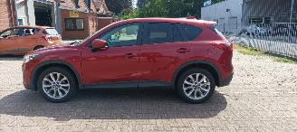 Vaurioauto  passenger cars Mazda CX-5 2.2 175pk Automatik 4x4 Navigatie Xenon Climatecontrol CruiseControl Stoelverwarming Lichtautomaat Privacyglas Regensensor Achteruitrijcamera Keyless entry 2014/7